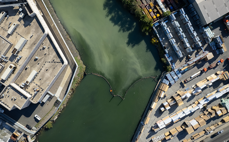 Aerial view of urban zone with canal running through center.